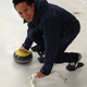 Caltech physicist Clifford Cheung about to throw a curling stone. (Image: Jennifer Ouellette)